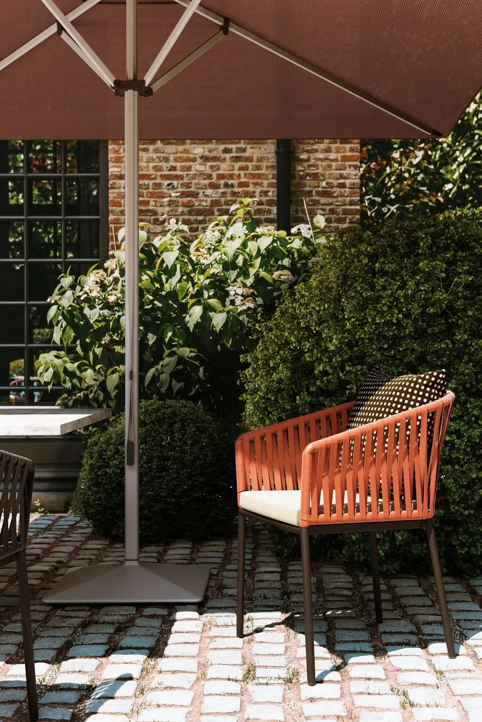 Kettal Bitta outdoor furniture in use, catalog photograph