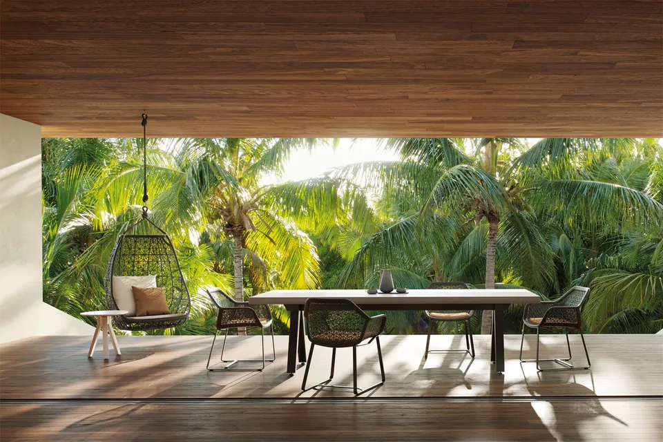 Kettal Maia outdoor furniture in use, catalog photograph