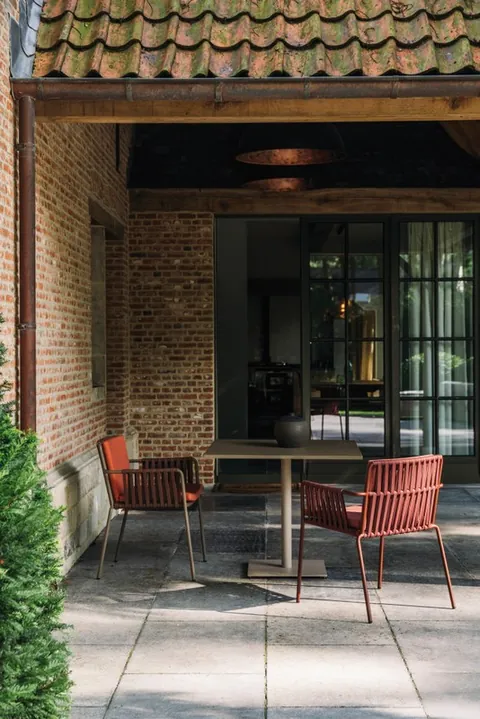 Kettal Net outdoor furniture in use, catalog photograph