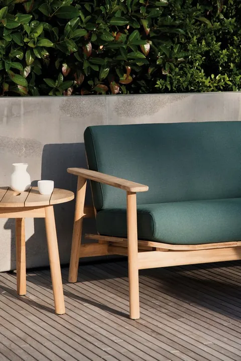Kettal Riva outdoor furniture in use, catalog photograph