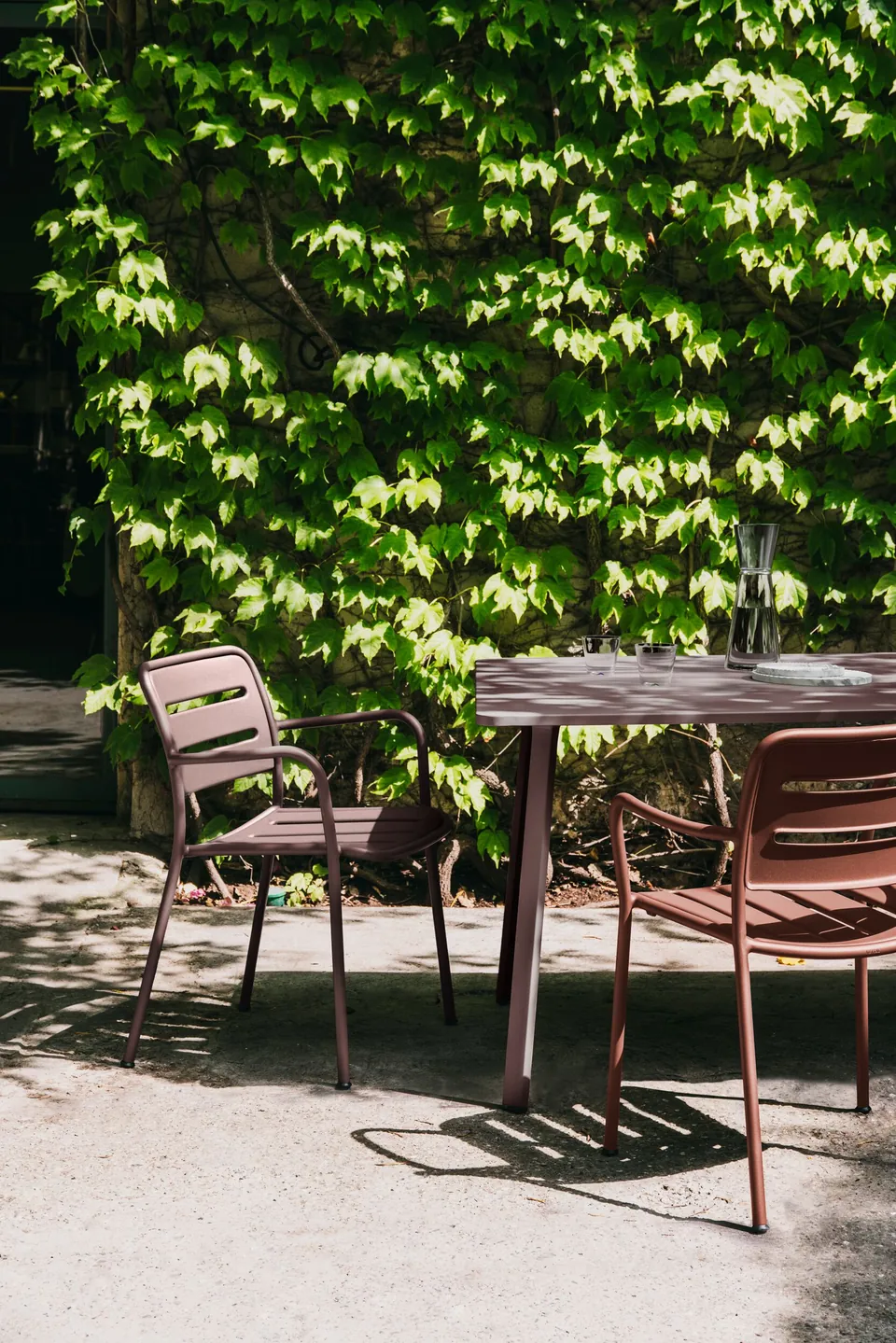 Kettal Village outdoor furniture in use, catalog photograph